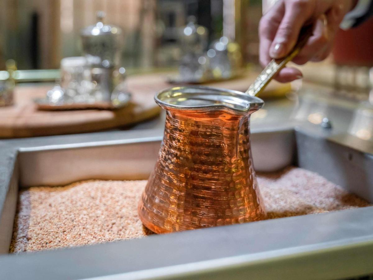 Mercure Trabzon Hotel Экстерьер фото Turkish coffee being prepared in a cezve